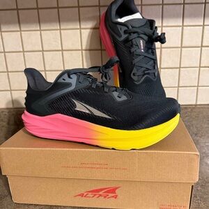 New in box. Women’s ALTRA Black, Pink, Yellow Torin 8 Running Shoe.  Size 9 Wide